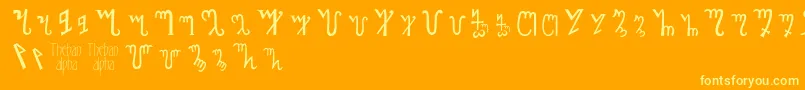 フォントThebanalphabet – オレンジの背景に黄色の文字