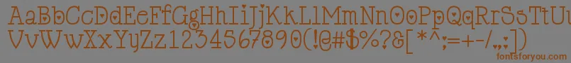 Шрифт Cupiddelocke – коричневые шрифты на сером фоне