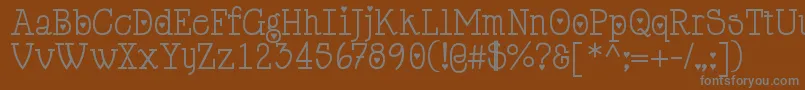 フォントCupiddelocke – 茶色の背景に灰色の文字