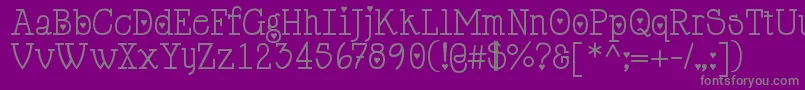 Cupiddelocke-fontti – harmaat kirjasimet violetilla taustalla