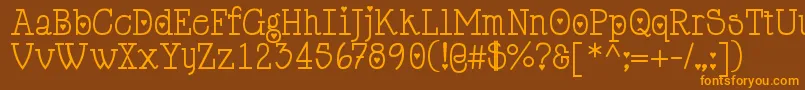 フォントCupiddelocke – オレンジ色の文字が茶色の背景にあります。