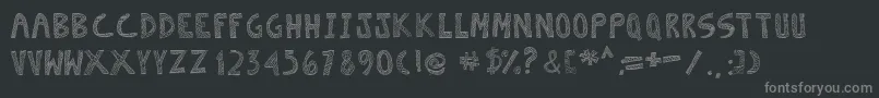 Escaned-fontti – harmaat kirjasimet mustalla taustalla