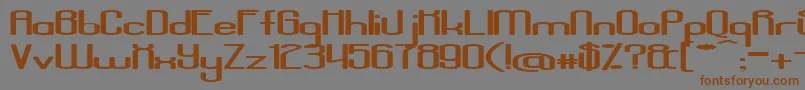 フォントAposiopesisDwarfed – 茶色の文字が灰色の背景にあります。