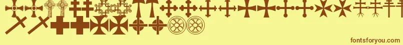 フォントCrossbatsTfb – 茶色の文字が黄色の背景にあります。