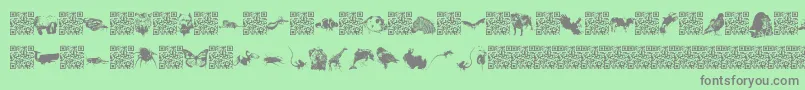 Czcionka Worldbeings – szare czcionki na zielonym tle