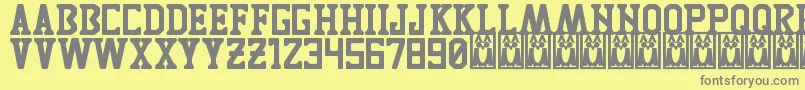 TigresUanl-Schriftart – Graue Schriften auf gelbem Hintergrund