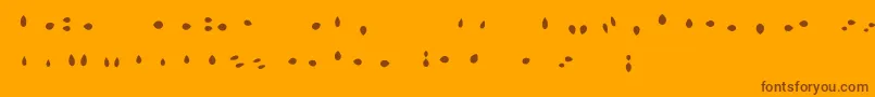 Fonte MisterLoopyLoops – fontes marrons em um fundo laranja
