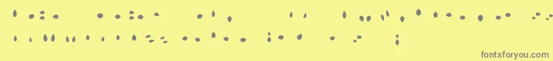 MisterLoopyLoops-Schriftart – Graue Schriften auf gelbem Hintergrund