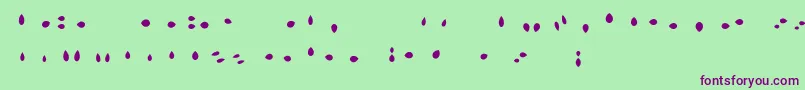 Fonte MisterLoopyLoops – fontes roxas em um fundo verde