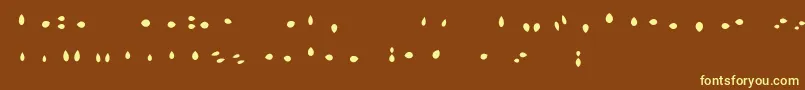 fuente MisterLoopyLoops – Fuentes Amarillas Sobre Fondo Marrón
