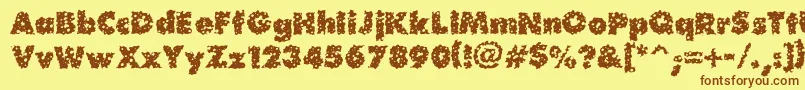 フォントWaterhole – 茶色の文字が黄色の背景にあります。