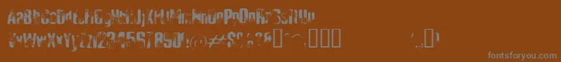 ElliotsBadDay4-fontti – harmaat kirjasimet ruskealla taustalla
