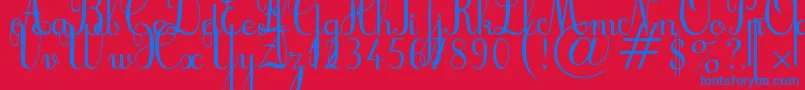 Cursif-Schriftart – Blaue Schriften auf rotem Hintergrund