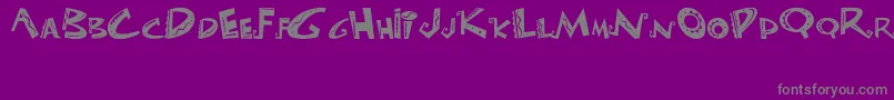 フォントLasLocurasDelEmperador – 紫の背景に灰色の文字