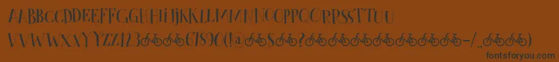 CykelsmedDemo Font – Black Fonts on Brown Background