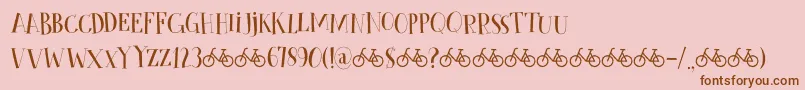 CykelsmedDemo-fontti – ruskeat fontit vaaleanpunaisella taustalla