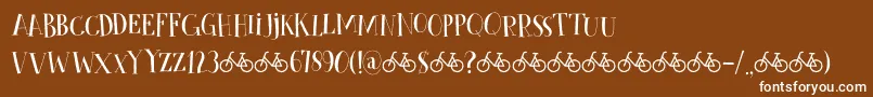 CykelsmedDemo-fontti – valkoiset fontit ruskealla taustalla