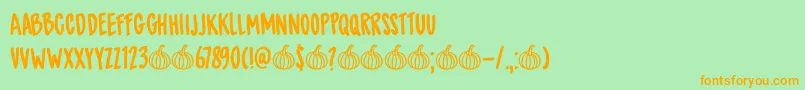 DkSpicedPumpkin-Schriftart – Orangefarbene Schriften auf grünem Hintergrund