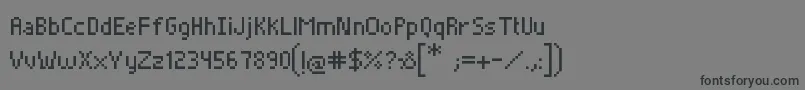 Czcionka Pixelade – czarne czcionki na szarym tle
