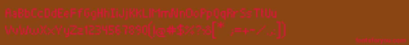 フォントPixelade – 赤い文字が茶色の背景にあります。