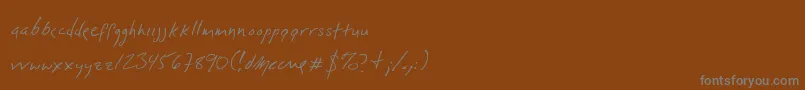 フォントDlylehand – 茶色の背景に灰色の文字