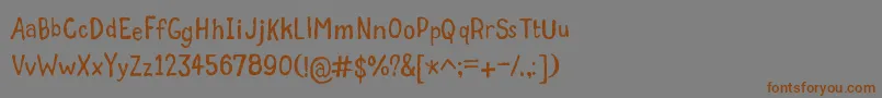 フォントGrumbleTt – 茶色の文字が灰色の背景にあります。