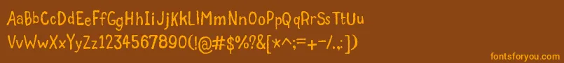 GrumbleTt Font – Orange Fonts on Brown Background
