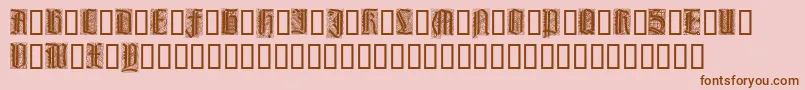 LiturgischZierbuchstaben-Schriftart – Braune Schriften auf rosa Hintergrund