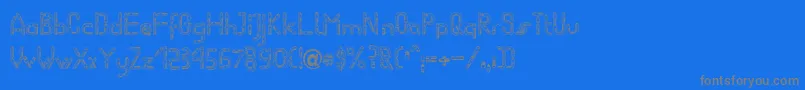 フォントWormBecker – 青い背景に灰色の文字