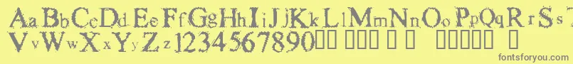 フォントFuzzysockThin – 黄色の背景に灰色の文字