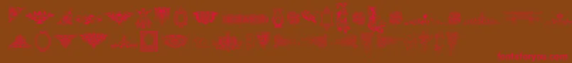 フォントVictorianFreeOrnamentsTwo – 赤い文字が茶色の背景にあります。