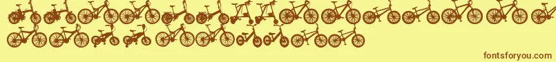 フォントBicycleTfb – 茶色の文字が黄色の背景にあります。