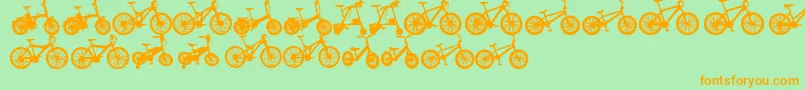 フォントBicycleTfb – オレンジの文字が緑の背景にあります。