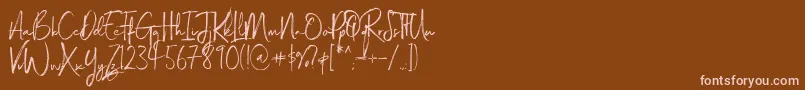 Magnite-Schriftart – Rosa Schriften auf braunem Hintergrund