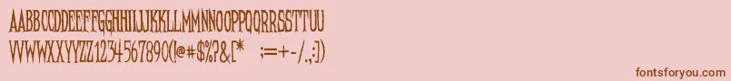 NeedleteethRegular-Schriftart – Braune Schriften auf rosa Hintergrund