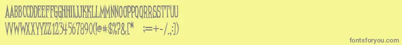 NeedleteethRegular Font – Gray Fonts on Yellow Background