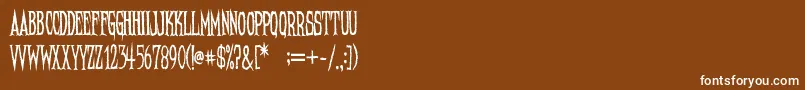 fuente NeedleteethRegular – Fuentes Blancas Sobre Fondo Marrón