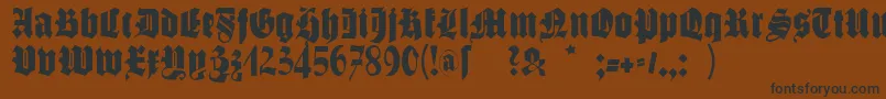 フォントSchmalfettegotisch – 黒い文字が茶色の背景にあります