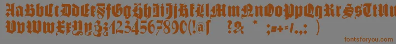 フォントSchmalfettegotisch – 茶色の文字が灰色の背景にあります。