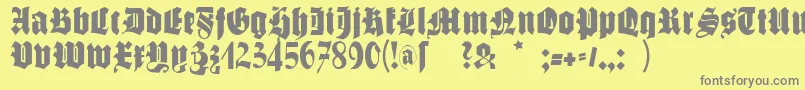 フォントSchmalfettegotisch – 黄色の背景に灰色の文字