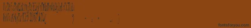 Czcionka XР’ntrica – czarne czcionki na brązowym tle