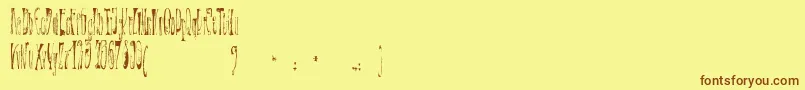 XР’ntrica Font – Brown Fonts on Yellow Background