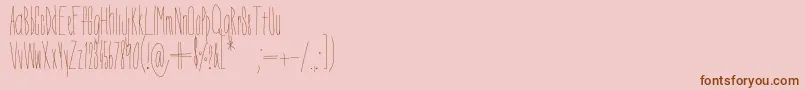 Czcionka DorothyMiranda – brązowe czcionki na różowym tle