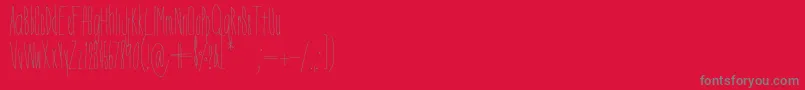 DorothyMiranda-fontti – harmaat kirjasimet punaisella taustalla