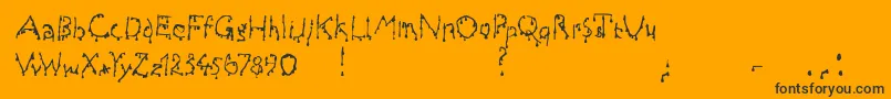 Draculas-fontti – mustat fontit oranssilla taustalla