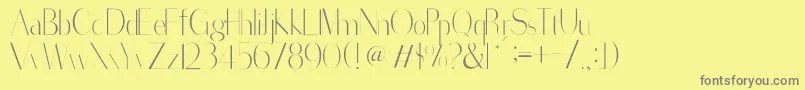 SorredaPro-fontti – harmaat kirjasimet keltaisella taustalla