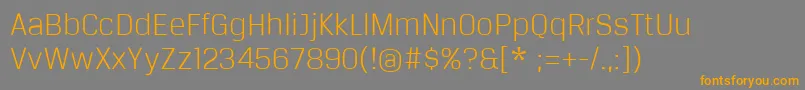 フォントBreuertextLight – オレンジの文字は灰色の背景にあります。