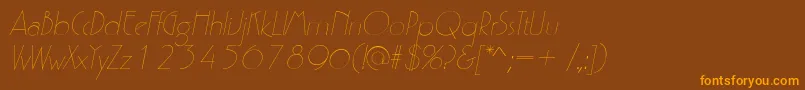 フォントP700DecoItalic – オレンジ色の文字が茶色の背景にあります。