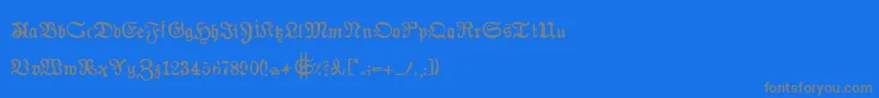 AuldmagickBold-Schriftart – Graue Schriften auf blauem Hintergrund