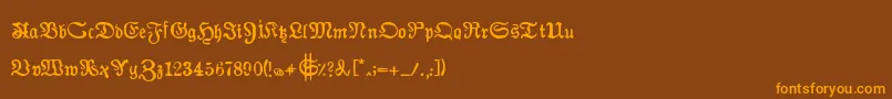 フォントAuldmagickBold – オレンジ色の文字が茶色の背景にあります。